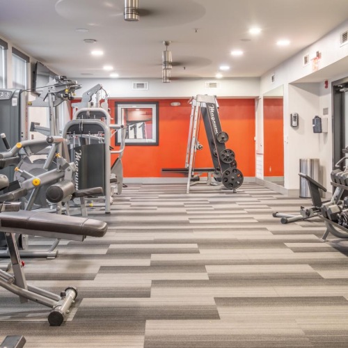 Cutting-edge amenities at your fingertips a room with a row of machines