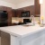a kitchen with a white counter top